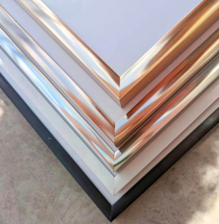 a stack of metal sheets sitting on top of a table