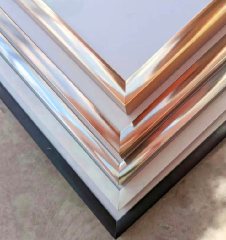 a stack of metal sheets sitting on top of a table