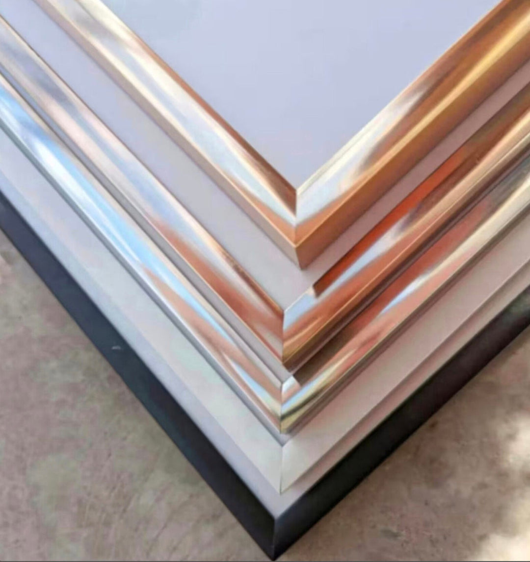 a stack of metal sheets sitting on top of a table