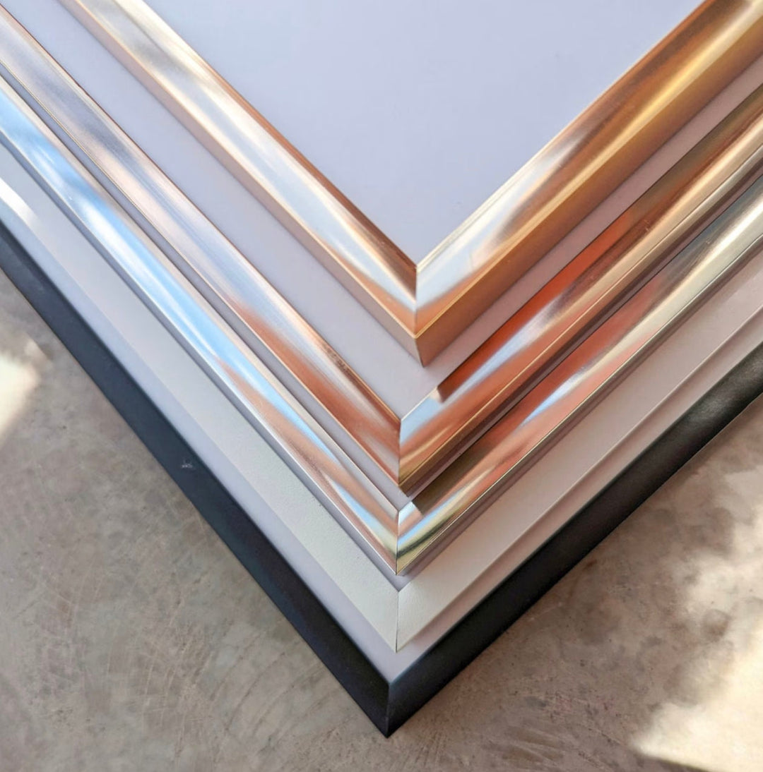 a stack of metal sheets sitting on top of a table