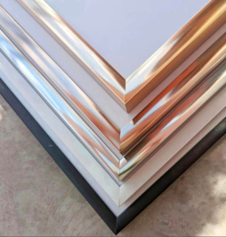 a stack of metal sheets sitting on top of a table