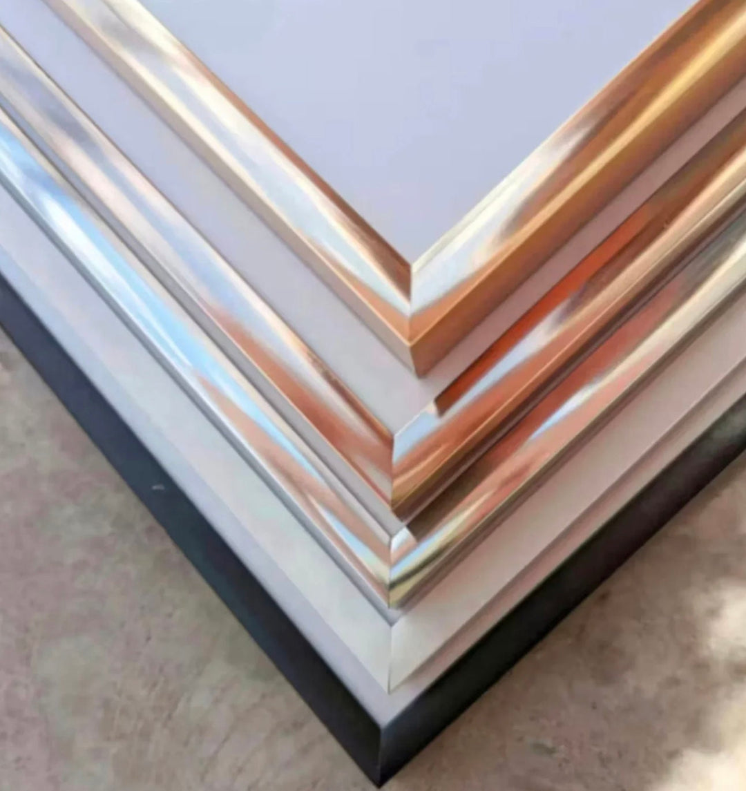 a stack of metal sheets sitting on top of a floor