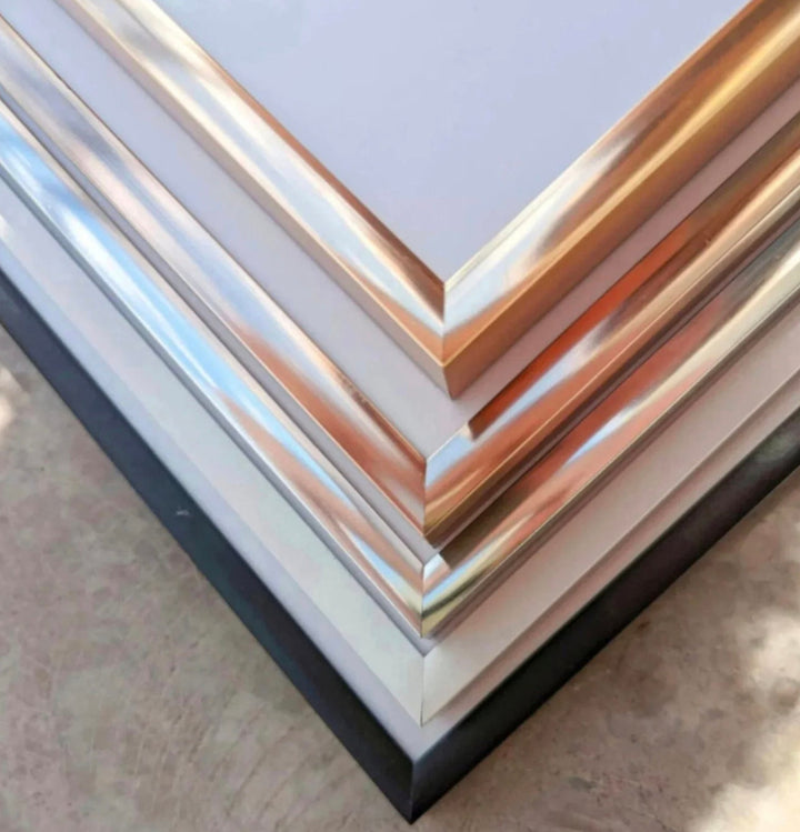 a stack of metal sheets sitting on top of a table