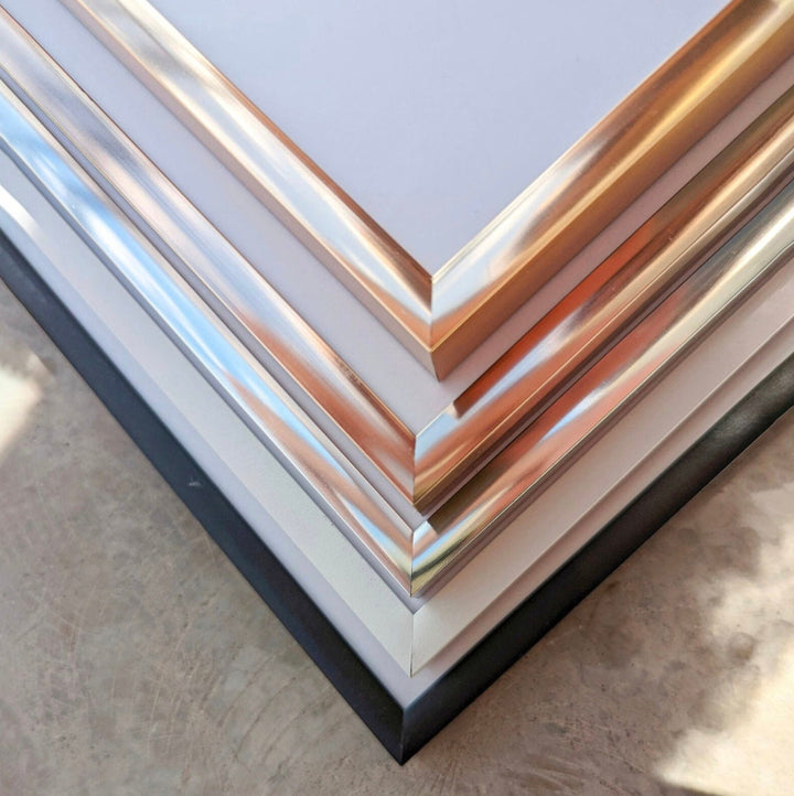 a stack of metal sheets sitting on top of a table