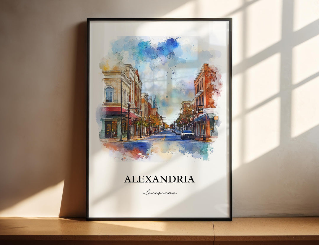 Alexandria Louisiana watercolor wall art in a black frame featuring a colorful downtown streetscape with historic storefronts, vibrant watercolor splashes, and classic Southern architecture.