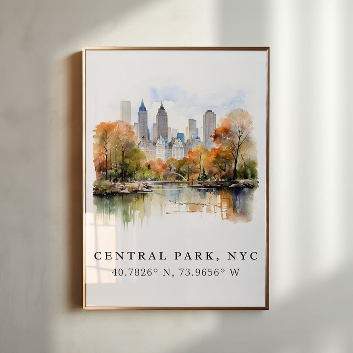 Central Park NYC watercolor wall art in a gold frame featuring a peaceful pond, autumn trees, and the Manhattan skyline in soft watercolor.
