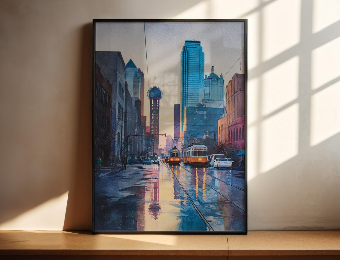 Dallas Texas watercolor wall art in a black frame featuring Reunion Tower, downtown skyline, vintage streetcars, and glowing sunset reflections.