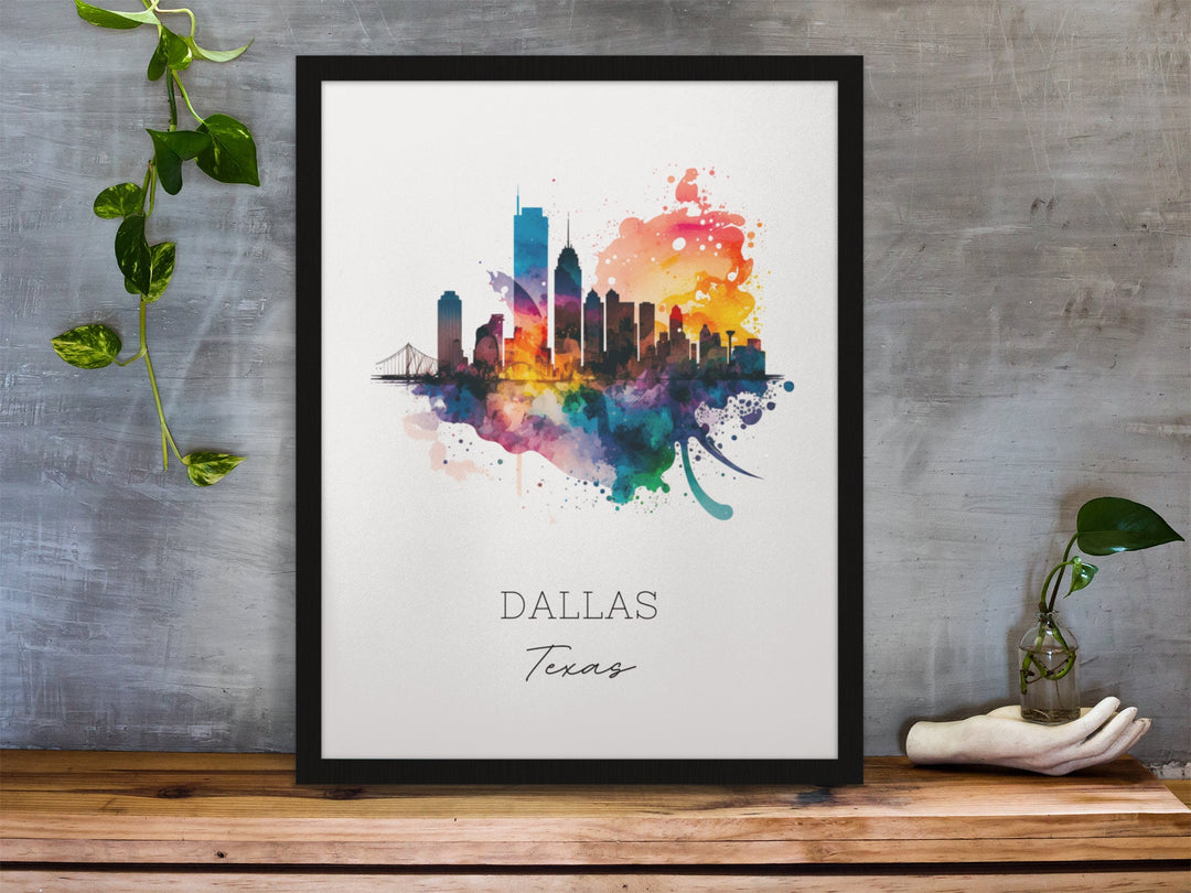 Dallas Texas watercolor wall art in a black frame featuring a colorful skyline silhouette, vibrant watercolor splashes, a white background, and gray lettering.