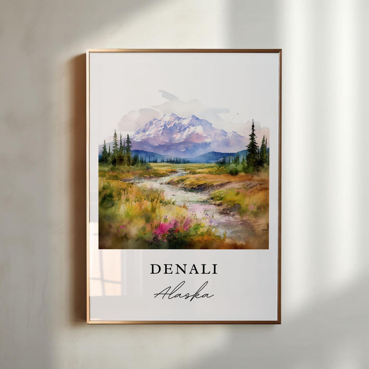 Denali Alaska watercolor wall art in a gold frame featuring the iconic snowcapped peak, winding stream, colorful wildflowers, and evergreen forests.