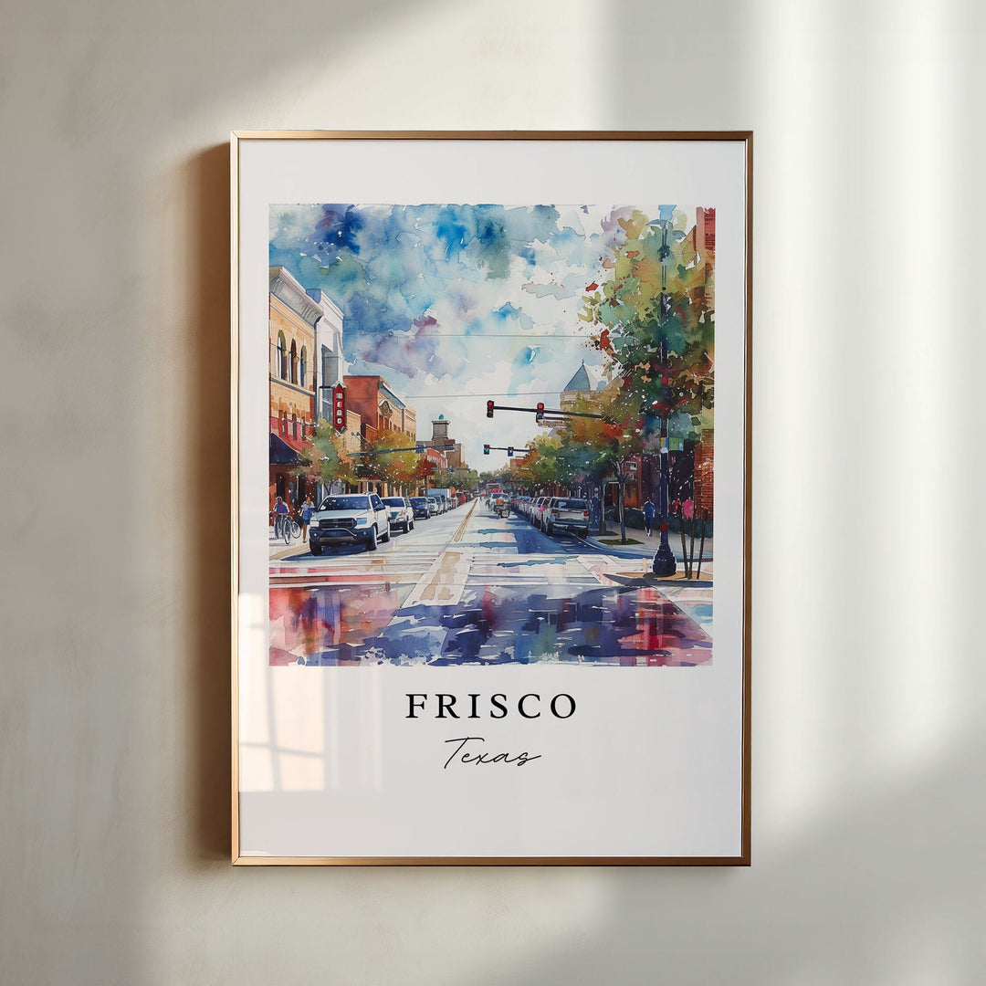 Frisco Texas watercolor wall art in a gold frame featuring historic downtown streets, colorful storefronts, leafy trees, and reflective pavement.