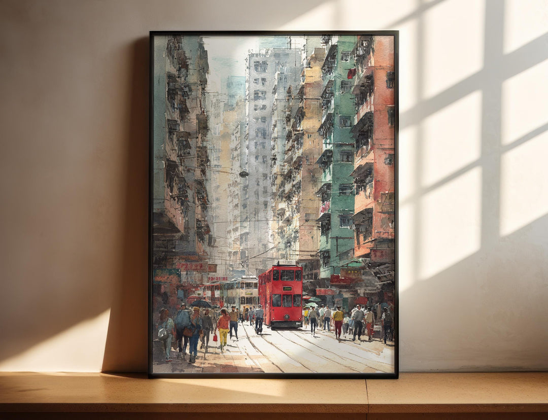 Hong Kong watercolor wall art in a black frame features a classic red tram passing lively city streets with rich urban character.