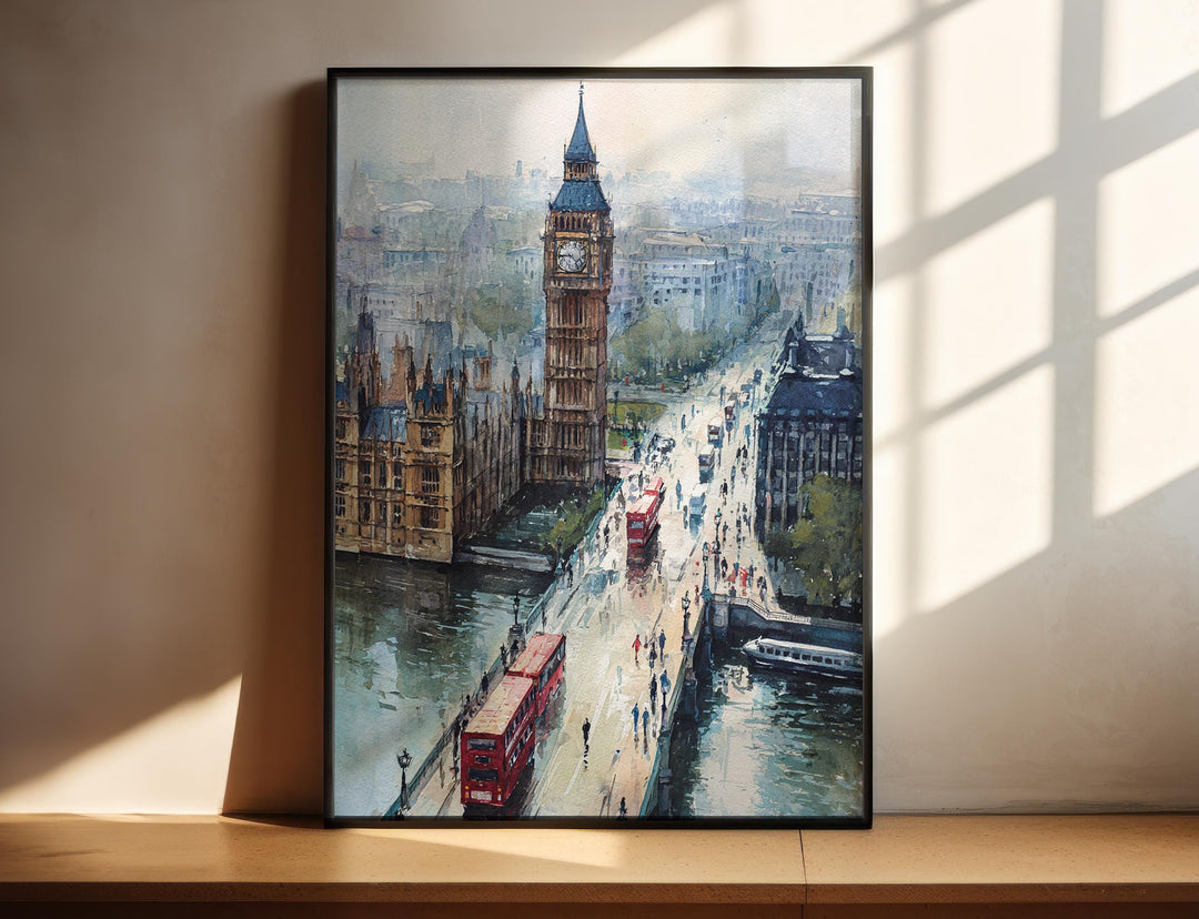 London England watercolor wall art in a black frame featuring Big Ben, Westminster Bridge, and iconic red double-decker buses.