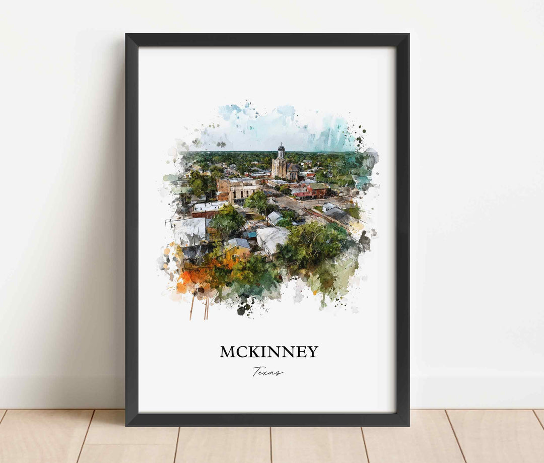 McKinney Texas watercolor wall art in a black frame featuring a scenic aerial view of historic downtown, the courthouse, lush greenery, and soft blue skies.