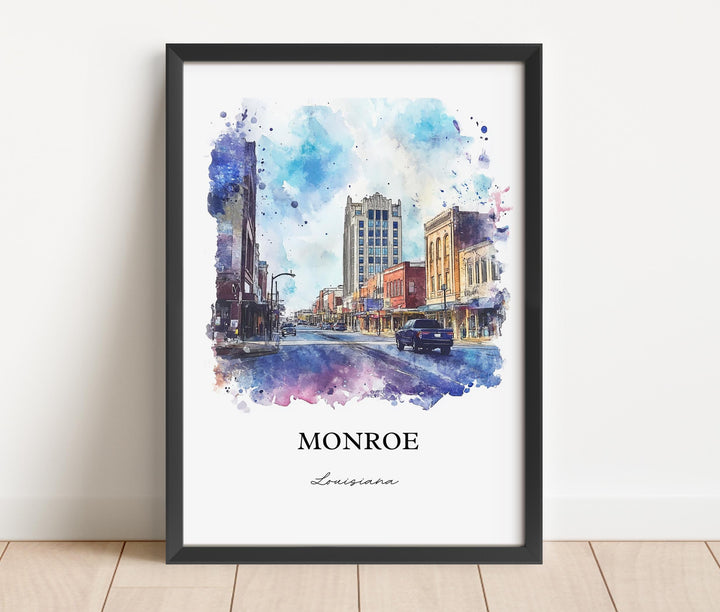 Monroe Louisiana watercolor wall art in a black frame featuring a vibrant downtown streetscape with historic buildings and colorful watercolor details.