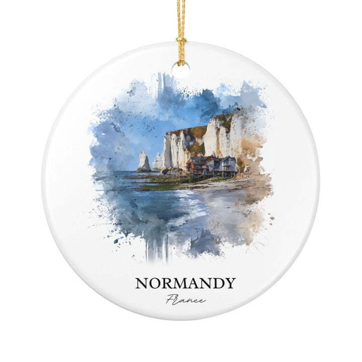 Normandy France white holiday ornament featuring a watercolor coastal scene with dramatic chalk cliffs, seaside cottages, and tranquil ocean views.