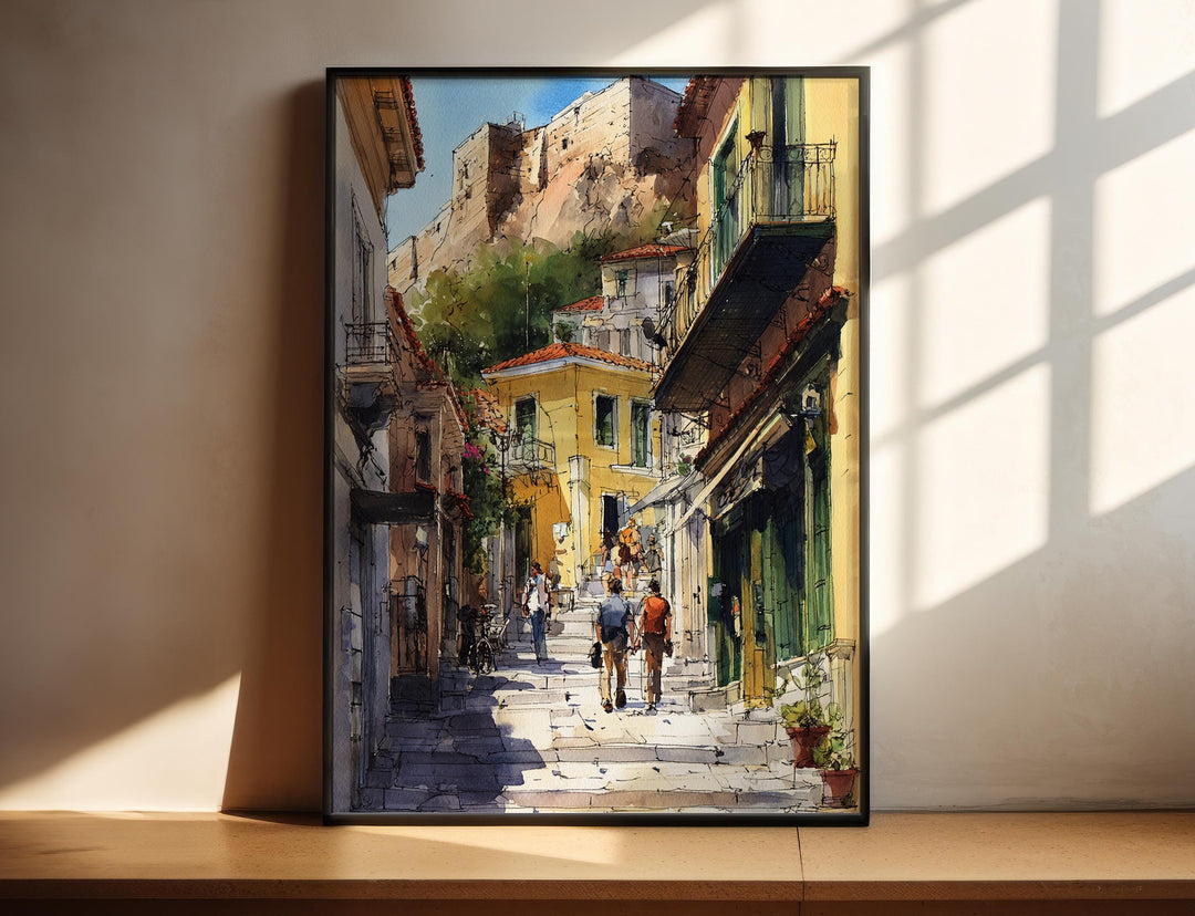 Athens Greece watercolor wall art in a black frame captures the neighborhood's charming stone streets beneath the Acropolis with vibrant detail.