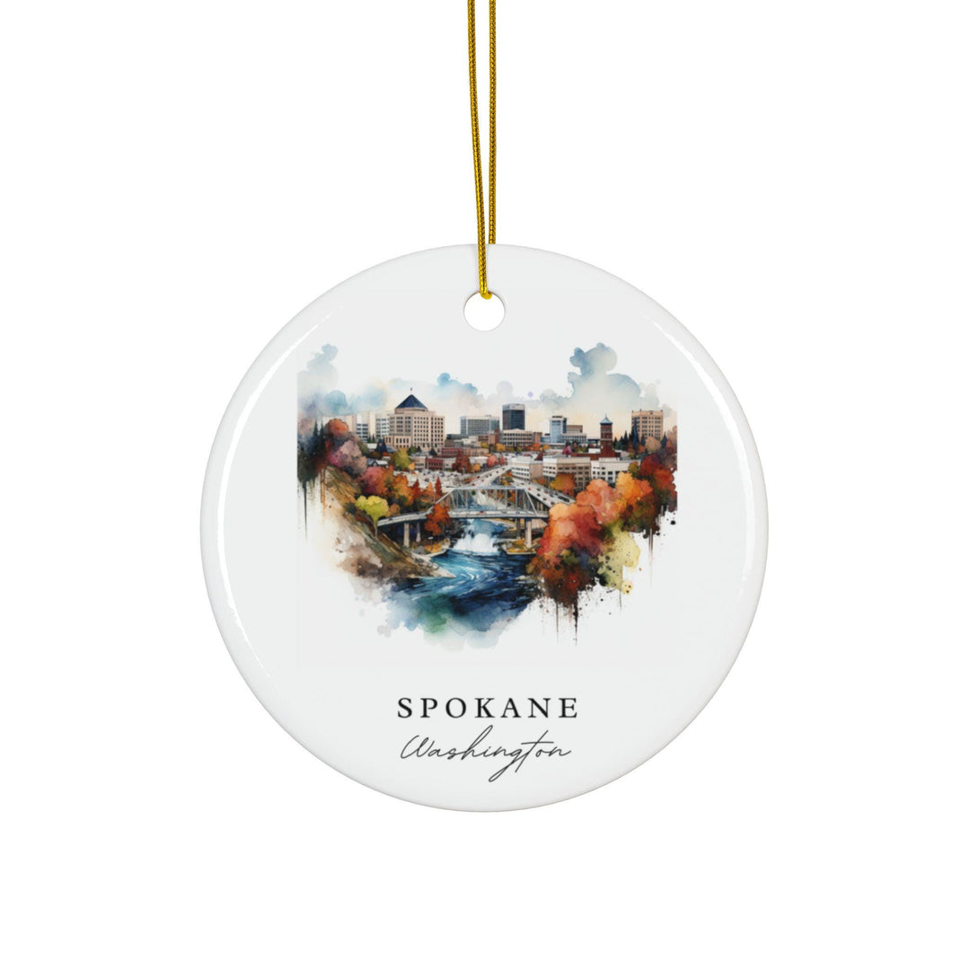 Spokane Washington white holiday ornament featuring a watercolor downtown skyline, river bridge, and colorful autumn scenery for holiday décor.