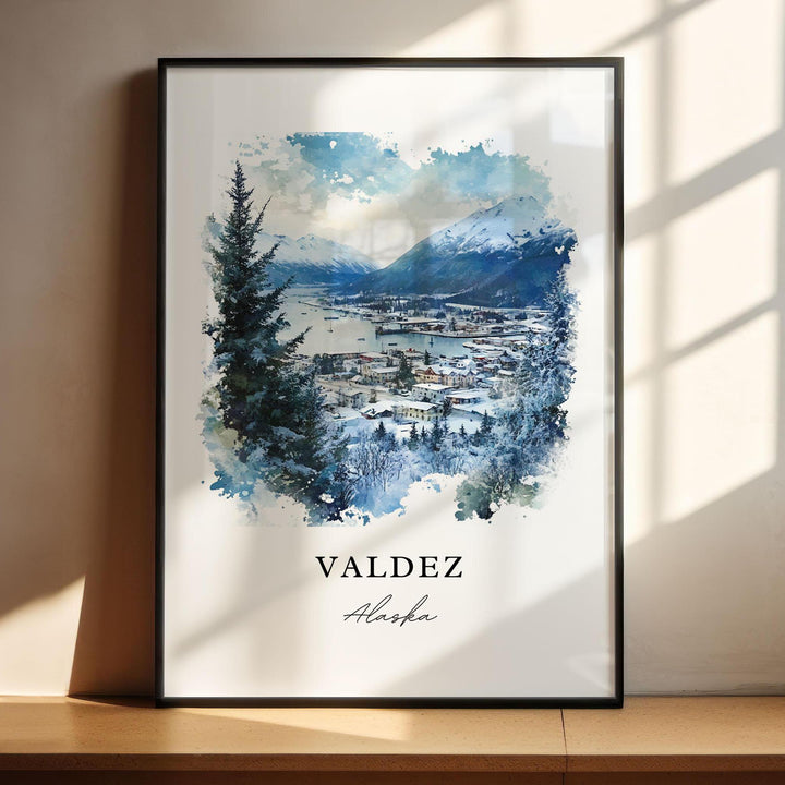 Valdez Alaska watercolor wall art in a black frame featuring a snowy harbor, towering mountain peaks, and crisp winter blue tones.
