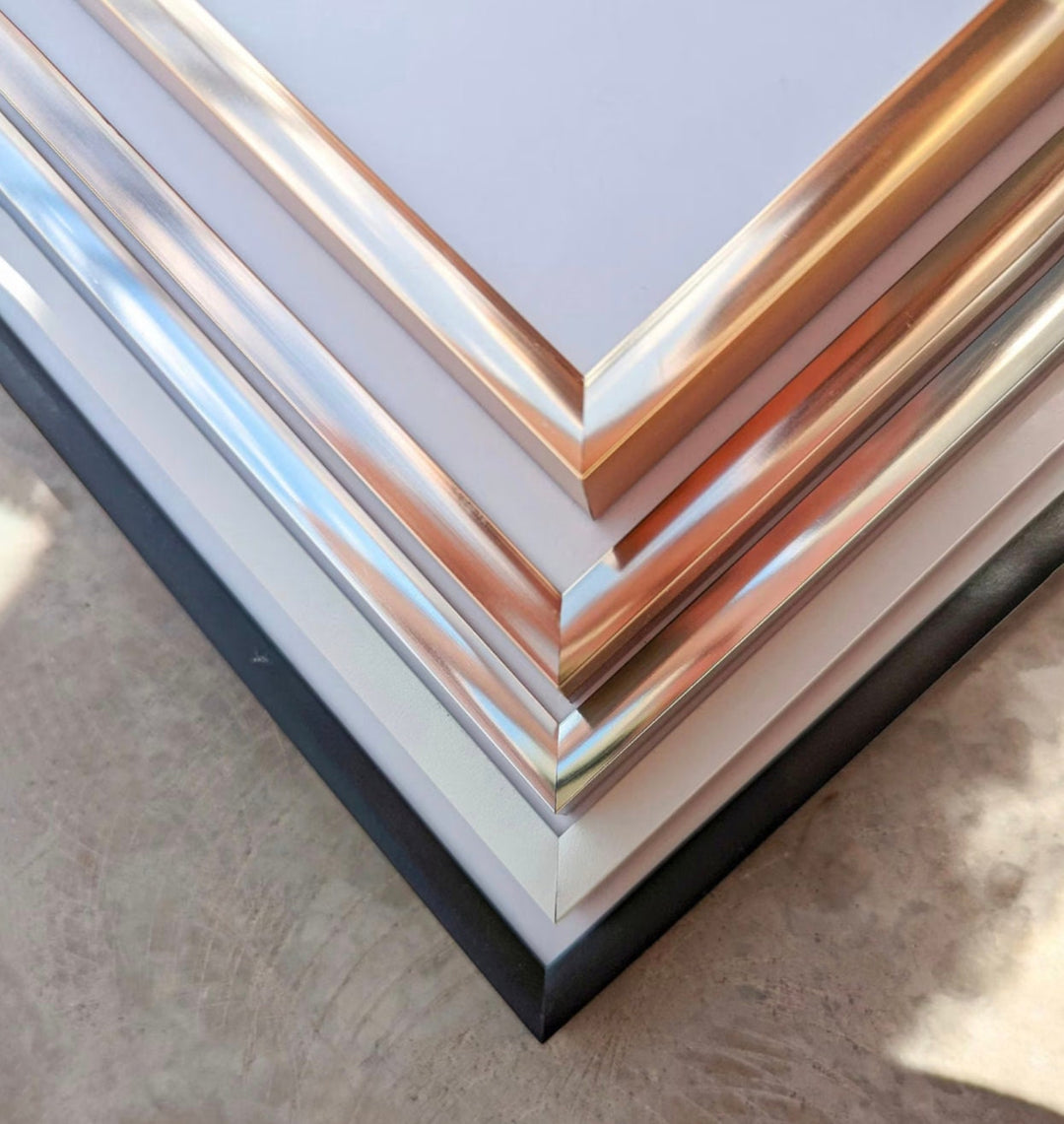 a stack of metal sheets sitting on top of a table