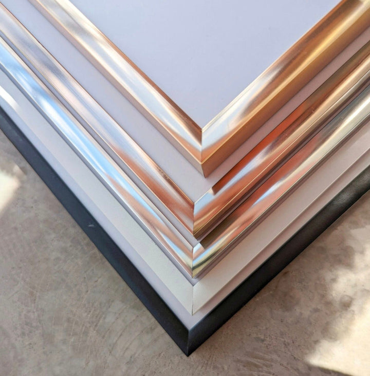 a stack of metal sheets sitting on top of a table