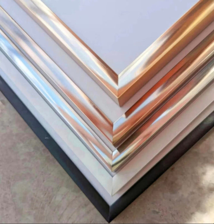 a stack of metal sheets sitting on top of a table