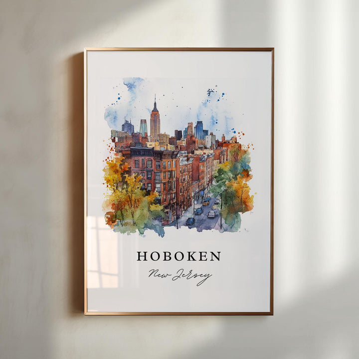 Watercolor travel art print of Hoboken, New Jersey featuring historic brick brownstone buildings and autumn trees with a prominent view of the Midtown Manhattan skyline and Empire State Building in the background, displayed in a gold frame.