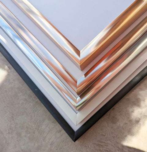 a stack of metal sheets sitting on top of a table
