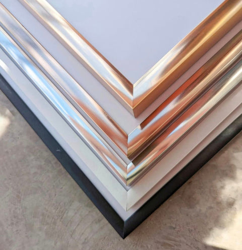 a stack of metal sheets sitting on top of a table