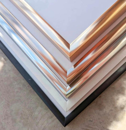 a stack of metal sheets sitting on top of a table