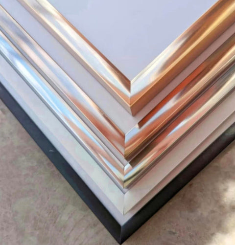 a stack of metal sheets sitting on top of a table