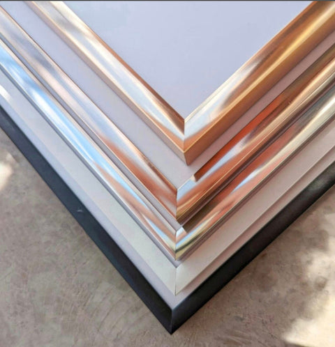 a close up of a stack of metal sheets