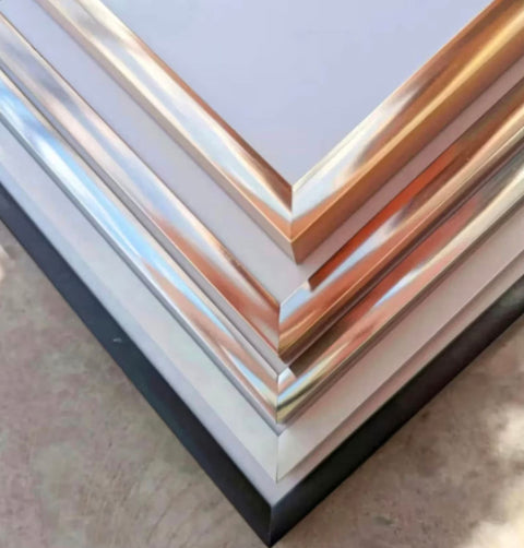 a stack of metal sheets sitting on top of a floor