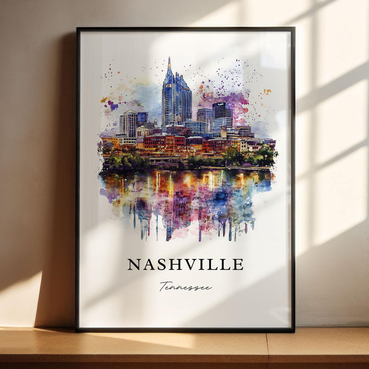 Vibrant watercolor travel art print of Nashville, Tennessee featuring the downtown city skyline with the iconic AT&T Batman Building reflecting on the Cumberland River, displayed in a black frame.