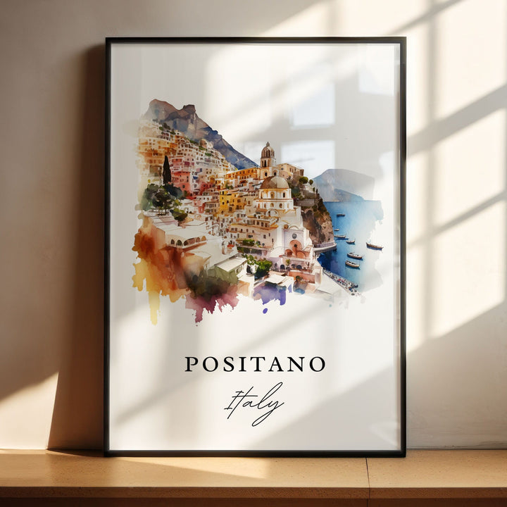 Watercolor travel art print of Positano, Italy featuring a colorful cliffside village with the iconic domed church overlooking blue Mediterranean waters and small boats, displayed in a black frame with window shadow lighting.